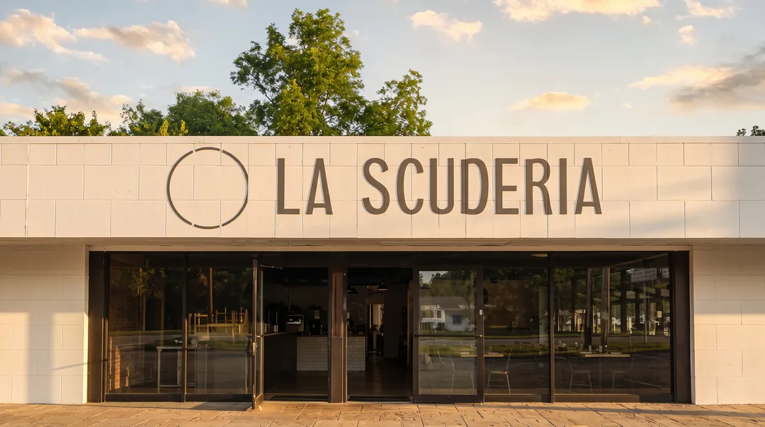 The La Scuderia building on York Street, name lettering across the white facade